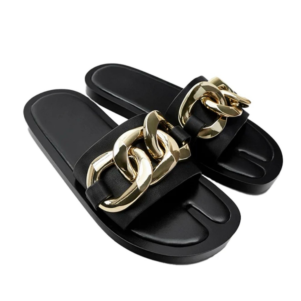 Black chain embellished slides.